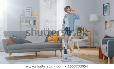 Stock photo: Woman Or Housewife With Vacuum Cleaner At Home