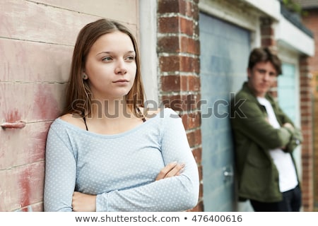 Foto d'archivio: Portrait Of Unhappy Teenage Couple In Urban Setting