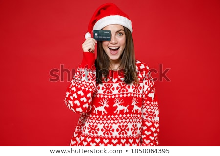 Foto stock: Cheerful Young Woman Wearing Sweater And Hat