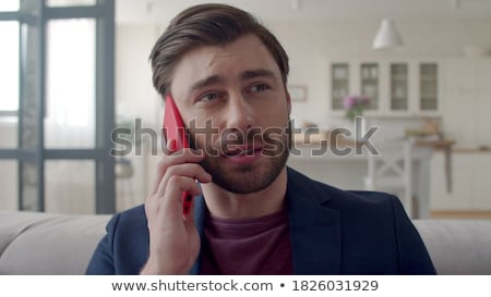 Stock fotó: Young Man Talking By Cellular Phone