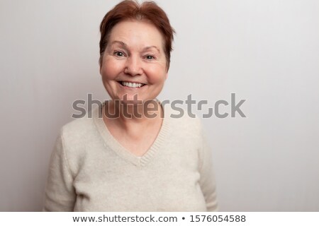 Foto stock: Stylish Pose Of Senior Smiling Woman