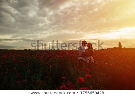 Сток-фото: Couple In Field Of Flowers