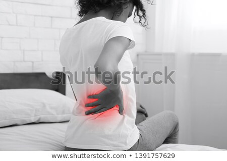 Zdjęcia stock: Closeup Of Young Woman Suffering From Back Pain