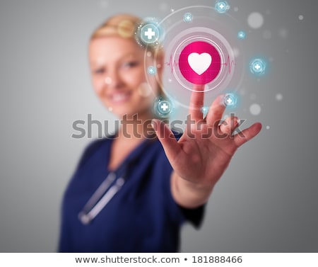 Stok fotoğraf: Young Nurse Pressing Modern Medical Type Of Buttons