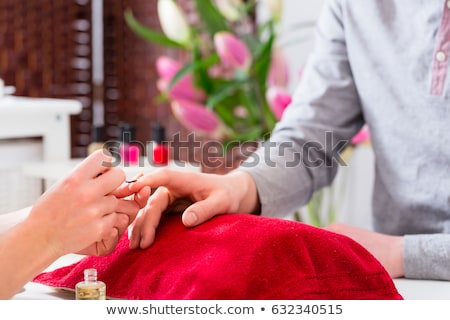 [[stock_photo]]: Man In Nail Salon Receiving Manicure