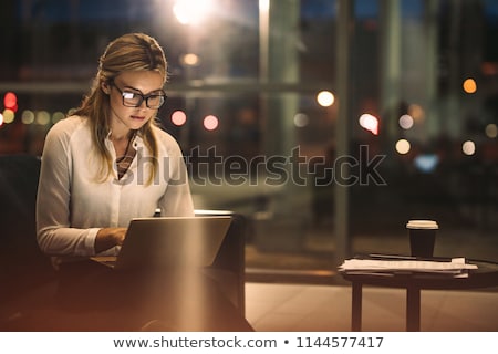 Foto stock: Woman Working In A Corporate Lobby