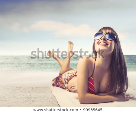 Foto stock: Happy Young Woman Sunbathing In Bikini Swimsuit