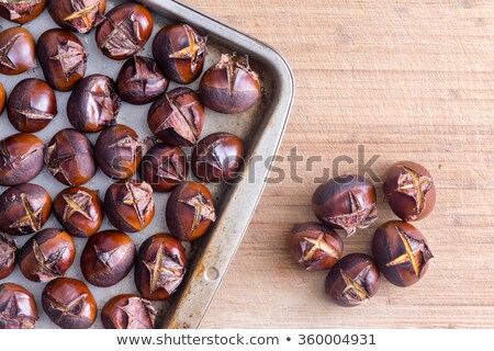 Foto stock: Tray Of Roasted Chestnuts On Table