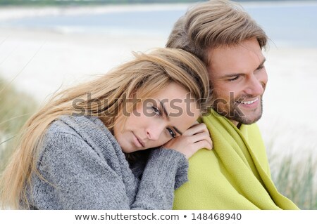 Сток-фото: Girls Sitting On Sand Dune With Blanket