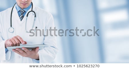 Zdjęcia stock: Dentist Doctor Using Digital Tablet Against Dental Equipment