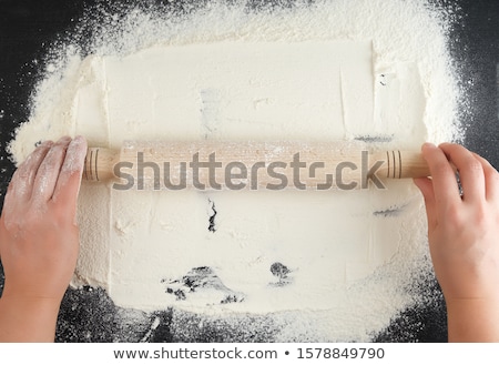 Stockfoto: Hand Rolling The Dough