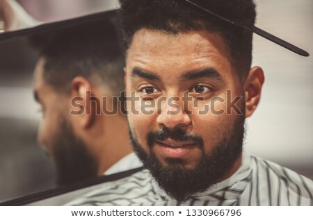 Foto stock: Pretty Hair Stylist Showing Man New Haircut