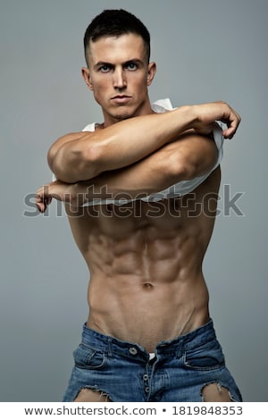 ストックフォト: Portrait Of A Shirtless Young Boy Posing - Studio Shot