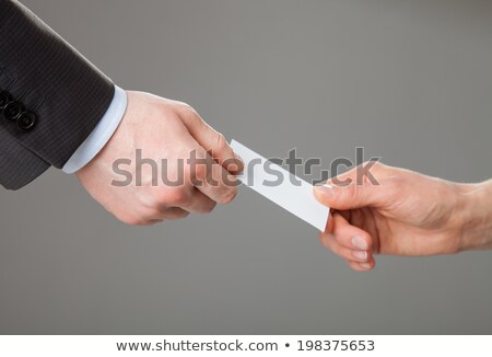 Imagine de stoc: Businesswoman Giving Out Name Tags