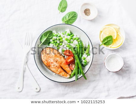 Stockfoto: Three Tomatoes On A Light Background