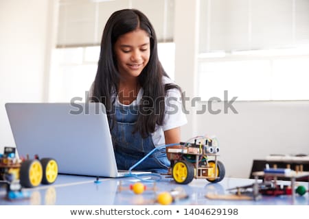 [[stock_photo]]: Happy Girl Building Robot At Robotics School