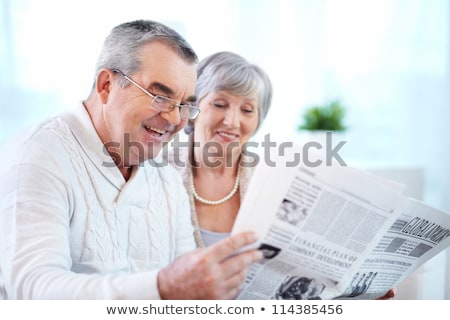 Stock fotó: Senior Couple Reading Newspaper