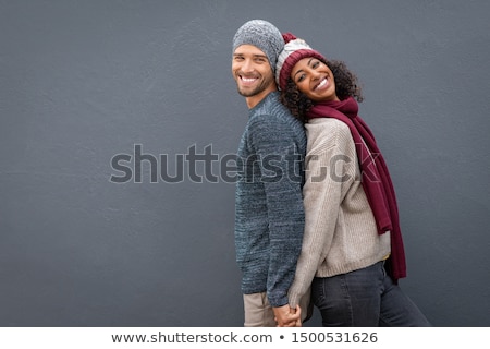 Stock fotó: Man Looking At The Camera With A Couple In The Background