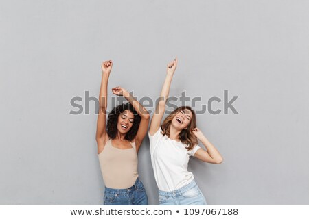 Stock photo: Cool Looking Two Dancing Woman On Grey