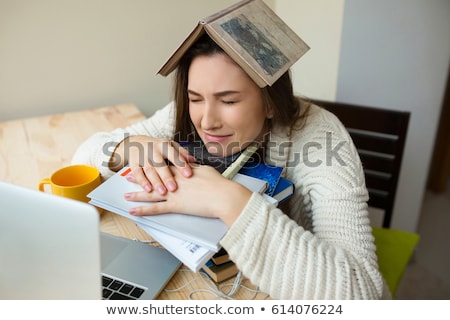 Zdjęcia stock: Sad Young Woman Studying In Library