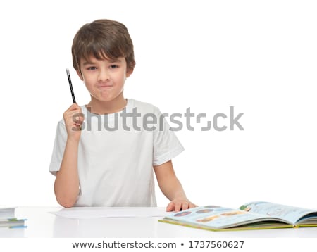 Zdjęcia stock: Cute Little Boy Doing Homework At Home