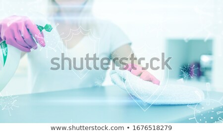 Stock photo: Woman Disinfects The Surface Of The Phone
