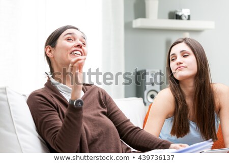 Parents And Daughter Sat On Settee Foto stock © Giulio_Fornasar