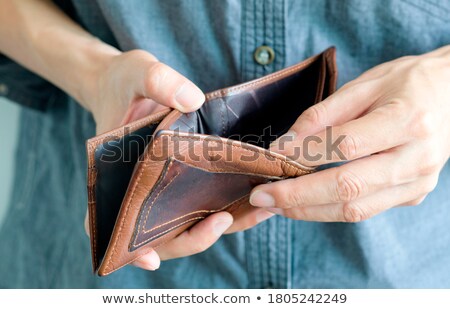 Stock photo: Man Surprised About His Empty Wallet