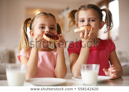 Сток-фото: Close Shot Of Blonde Eating A Toast