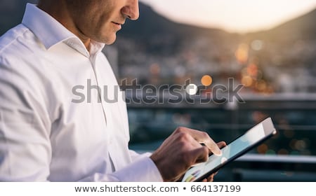 [[stock_photo]]: Businessman Reading From The Digital Tablet