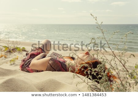 Foto d'archivio: Beautiful Woman With Closed Eyes Sunbathing