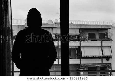 Stock photo: Silhouette Of Figure Through Curtains