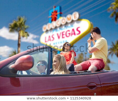 Stok fotoğraf: Friends With Camera Driving In Car At Las Vegas