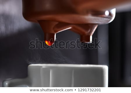 Macro Photo Of Dripping Coffee In A Coffee Machine Dripping Into A Cup The Process Of Making A Drin Сток-фото © artjazz