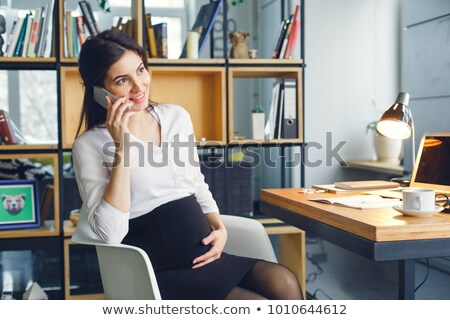 [[stock_photo]]: Pregnant Female At Work