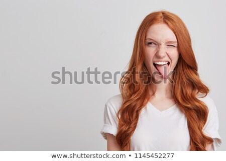Stock fotó: Smiling Teenage Girl In Red T Shirt Winking
