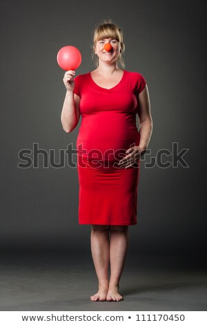 Portrait Of Beautiful Pregnant Woman In Red Dress - Studio Shot Foto stock © luckyraccoon