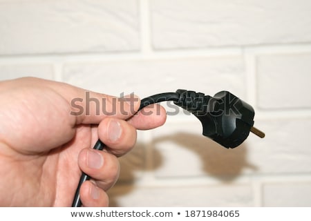 Stok fotoğraf: Electric Plug Connector Ac Outlet On Brick Wall