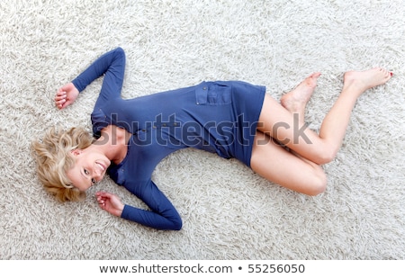 Foto stock: Lying Woman In Short Dress