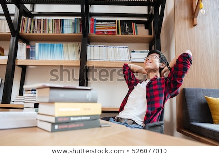 Stock foto: Asian Man Sleeping At The Library Near Laptop And Books