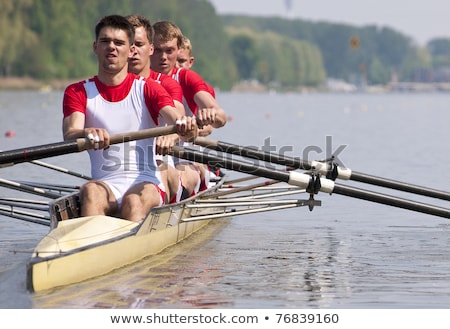 Stockfoto: Rowing Team During The Start