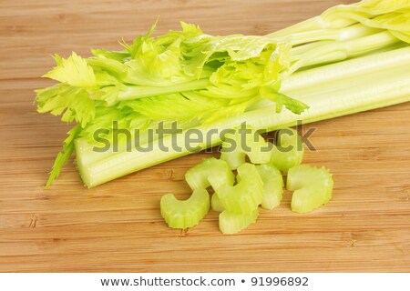 [[stock_photo]]: Fresh Slised Green Celery On Wooden Background