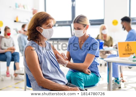 Stok fotoğraf: Doctor Man With A Syringe Vaccination And Injection