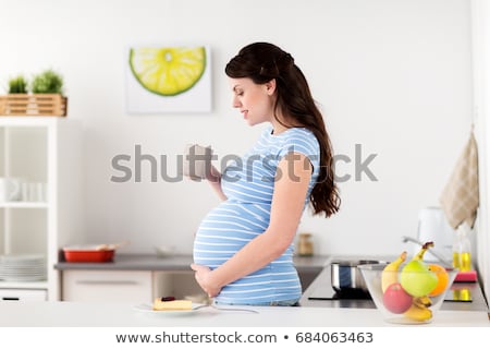 Stockfoto: Happy Smiling Pregnant Woman Drinking Tea