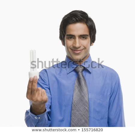 [[stock_photo]]: Indian Businessman Holding Idea Light Bulb