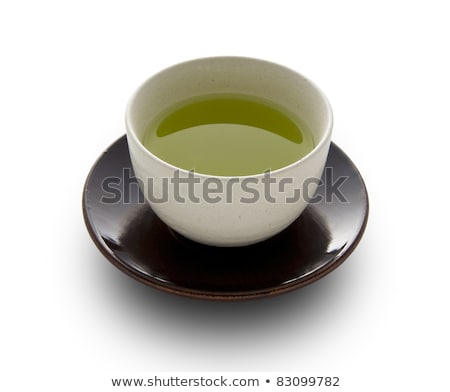 Foto stock: Loose Green Tea And Cup