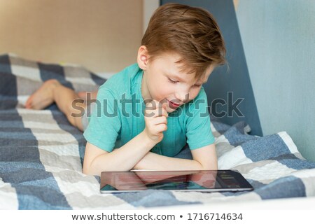 Stockfoto: Young Boy With A Tablet