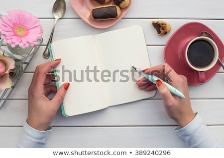 Сток-фото: Coffeecup With Coffee In It On A Wooden Table