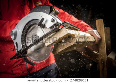 Stock photo: A Carpenter With A Circular Saw