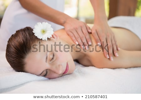 Stock photo: Attractive Woman Receiving Shoulder Massage At Spa Center